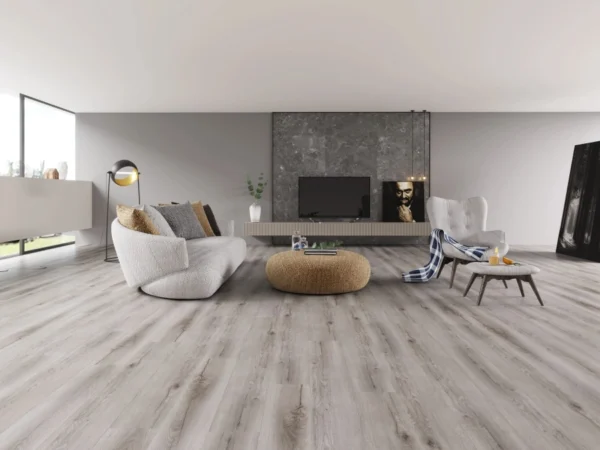 A living room with white walls and wooden floors.