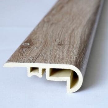 A close up of the edge of a wooden floor