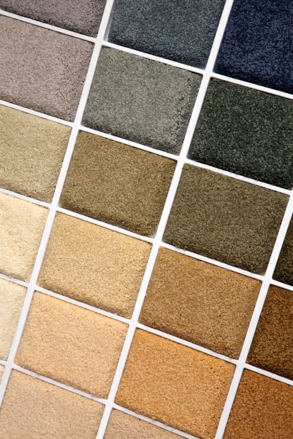 A close up of different colors of carpet