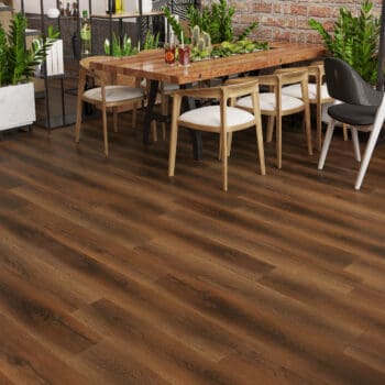 A table and chairs in front of a brick wall.