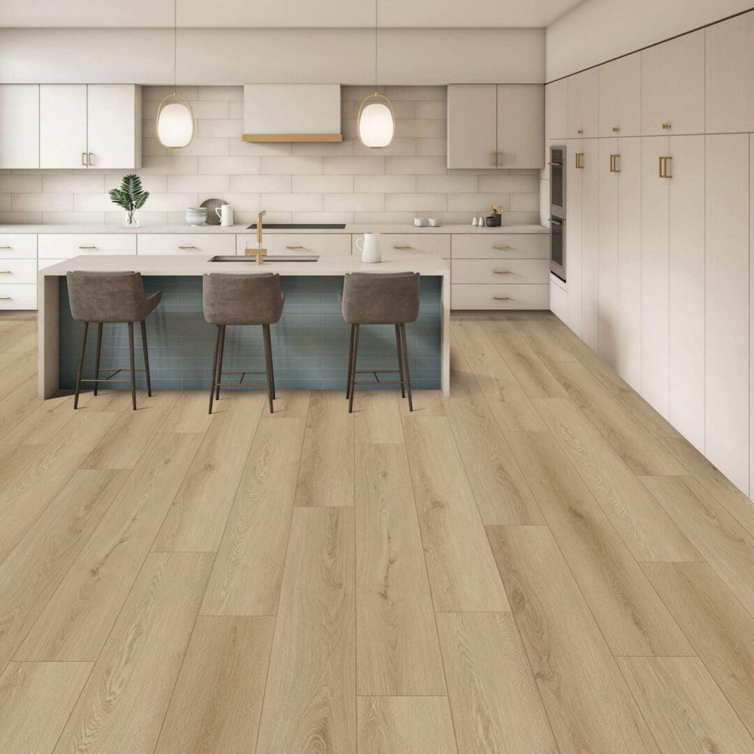 A kitchen with white cabinets and wood floors.